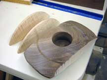 The maple strips cut from the walnut box body.