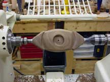 The walnut portion, turned along its long axis to the final shape.