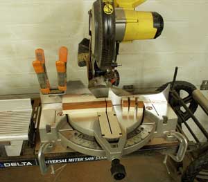 Checkerboard layers being cut on teh mitre saw.